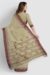 Khaki cotton handloom saree with chocolate Tangail border draped elegantly