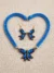 Peacock blue terracotta earrings with hand-painted butterfly motif